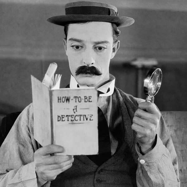 Sherlock Jr reading the How-To-Be-A-Detective book